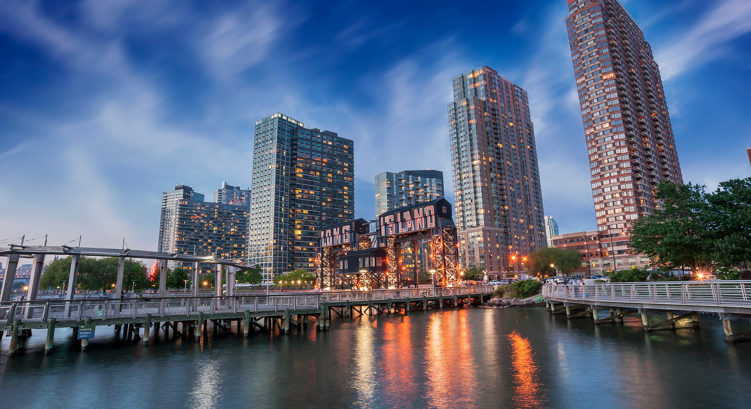 Long Island skyline with waterfront and pier.
